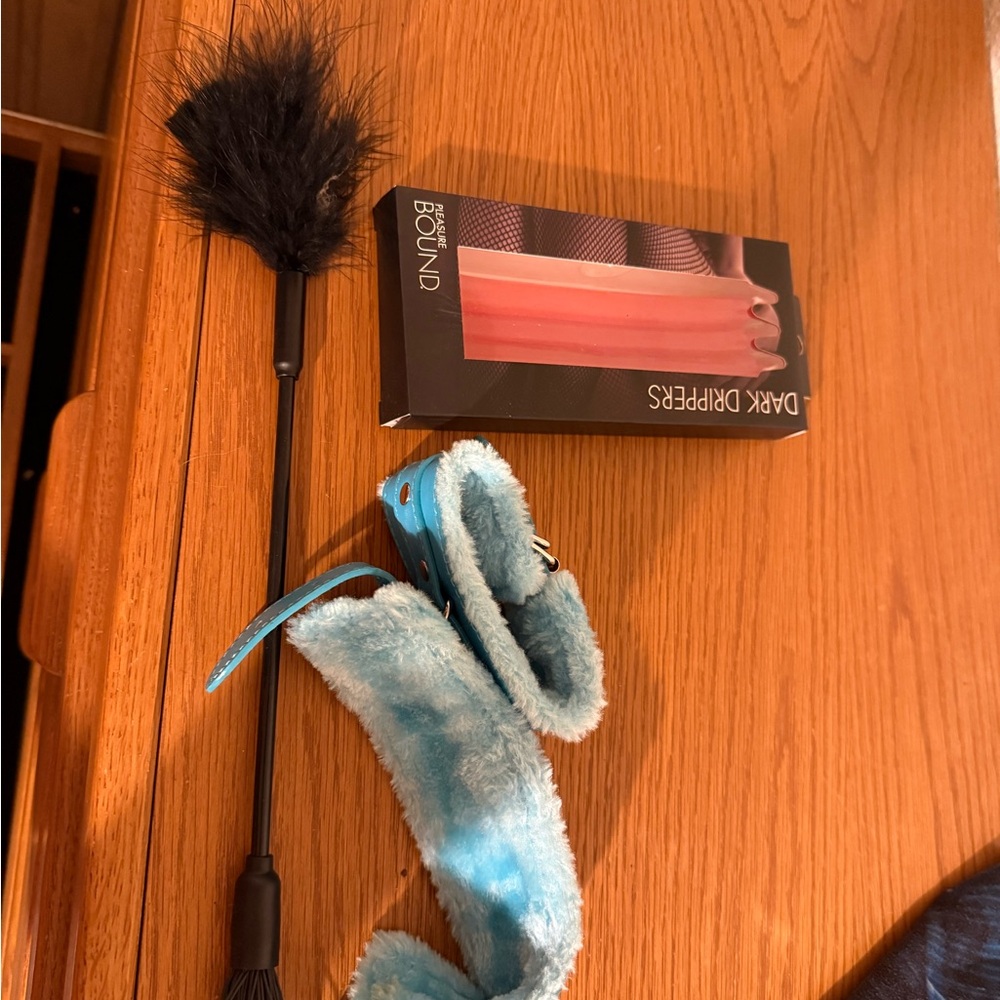 Spencer's Black Feather Tickler and Blue Fuzzy Cuffs Set